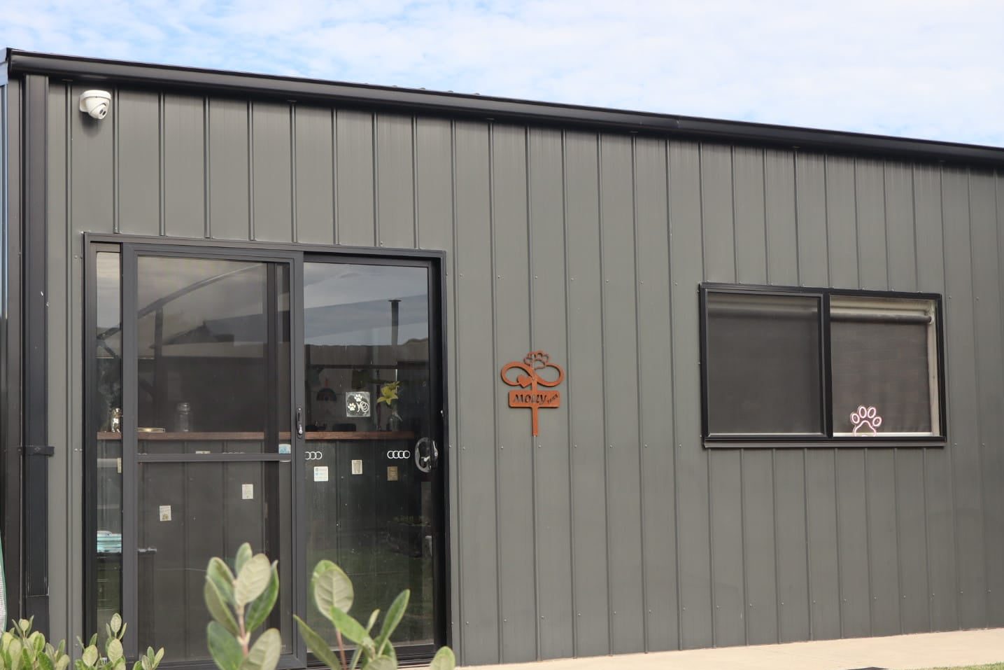 The exterior of the Molly's Paws dog grooming salon, operated by Alana the owner of Furever M.